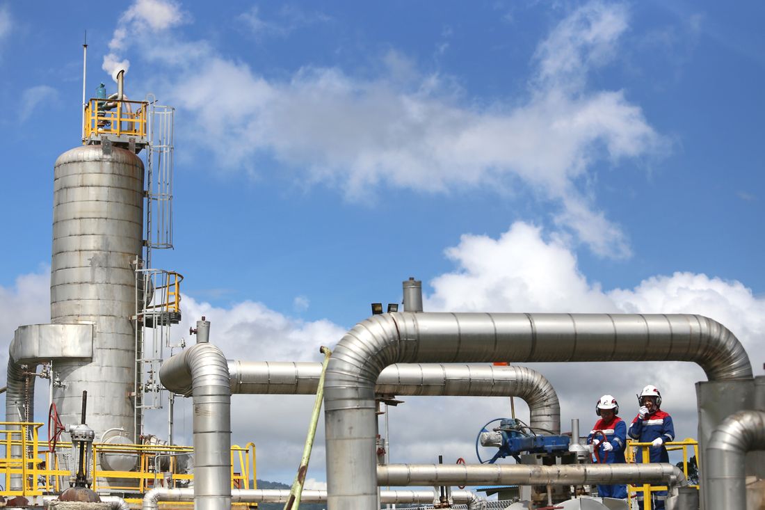 Operator inspecting industrial gas facility